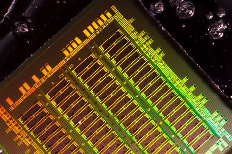 Integrating Photonics with Silicon Nanoelectronics Into Chip Designs