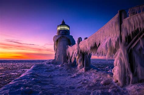 Frozen Lighthouse Sunset St. Joseph Michigan Photograph by Michelle ...