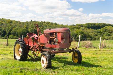 Vintage red tractor in landscape - License, download or print for £3.72 ...