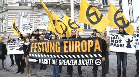 Demonstration in Vienna, with protestors holding flags bearing the ...