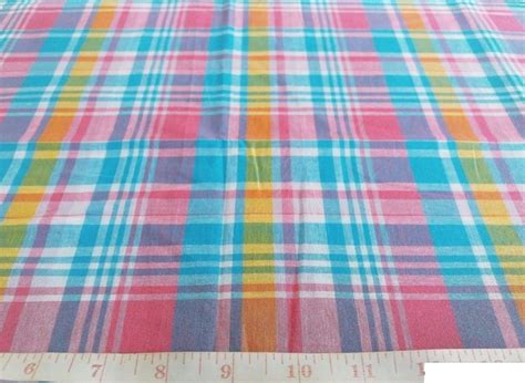 Madras Plaid Fabric made of cotton yarns woven in plaid pattern for shirts