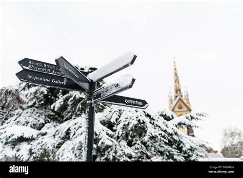 Directions sign in Hyde Park, with Albert Memorial in the background ...