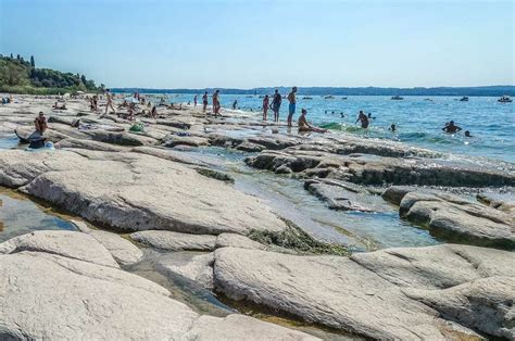 The flat rocks of Jamaica Beach - Sirmione, Lake Garda, Italy ...