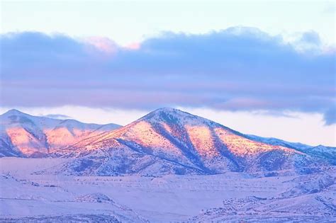 Sunrise On Snow Capped Mountains Photograph by Tracie Kaska