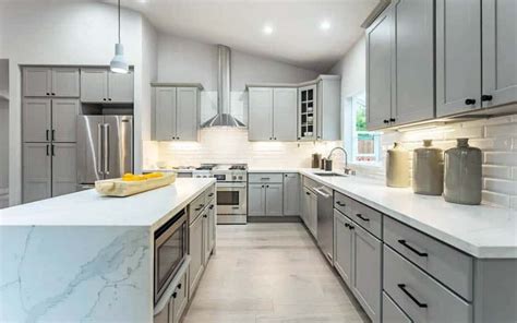 light gray kitchen cabinets with white countertops - redlinapolonia