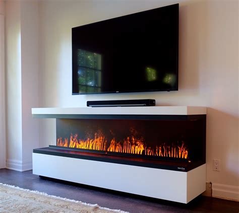 Fireplace with TV above. Water Vapor Technology Opti-Myst by Dimplex ...