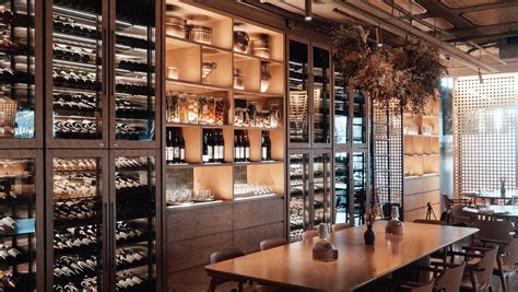 Modern restaurant with wine cellar in daylight · Free Stock Photo