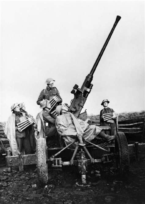 A typical 40mm Bofors anti-aircraft gun and crew in France. Naval ...