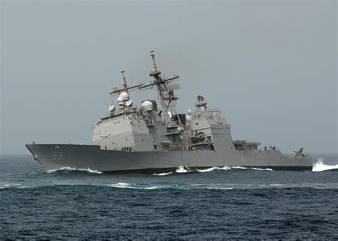 USS Mobile Bay (CG-53) pulls a hard turn to starboard, sometime during ...