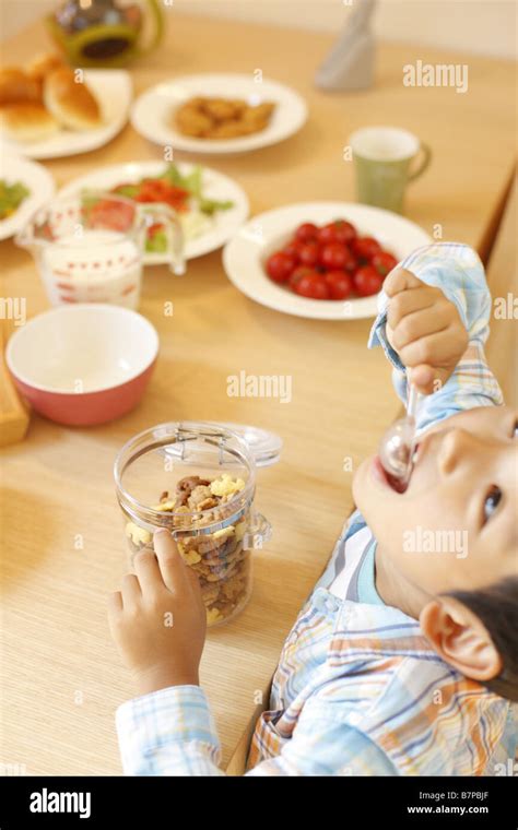 A boy having breakfast Stock Photo - Alamy