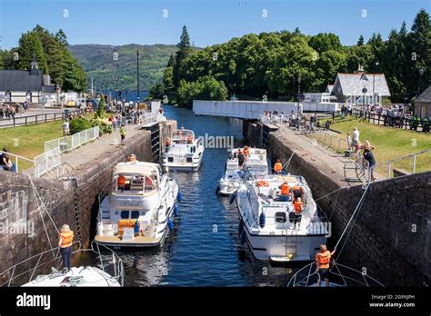 Leisure boats entering Loch Ness through the Caledonian Canal lock ...