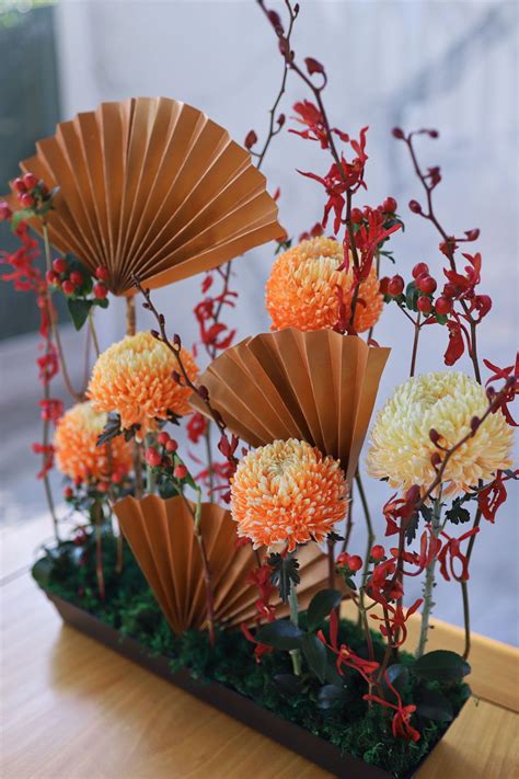 Chinese style flowers arrangement | Chinese new year flower, Chinese ...