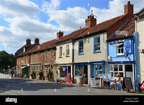 Shops and restaurants on Market Place, Burnham Market, Norfolk, England ...