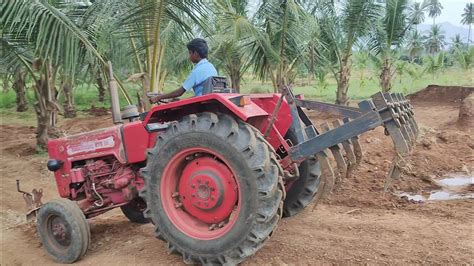 Mahindra 575 tractor goes to coconut tree land plough in 9 ...