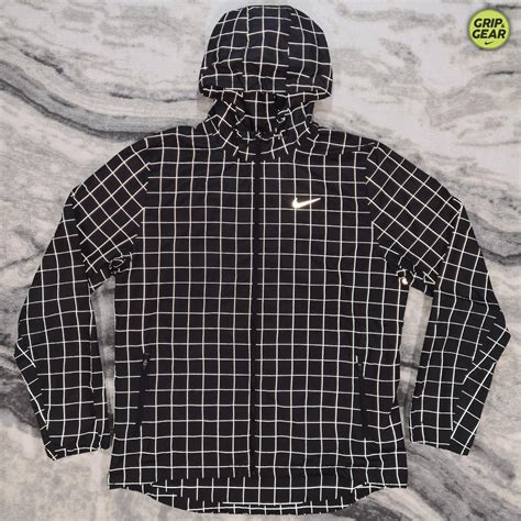 Nike Reflective Grid Windrunner Jacket, in Black... - Depop