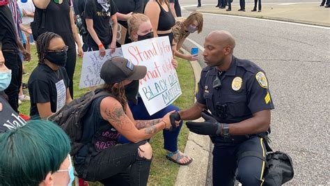 Alabama protests: Hoover police officer takes a knee; 17 arrests made ...