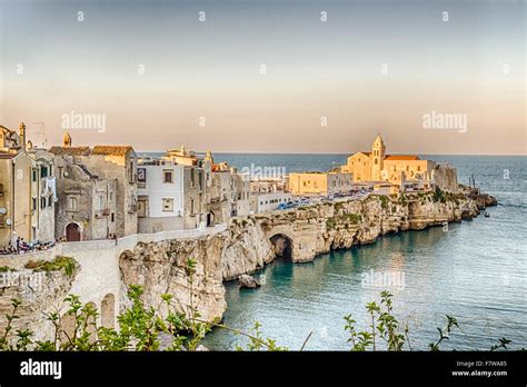 Vieste in Italy, an old Town on sea cliff and beaches: ancient houses ...