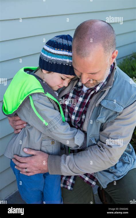 Father and son hugging Stock Photo - Alamy