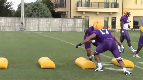 LSU assistant coach Brick Haley puts linebackers through a tackling ...