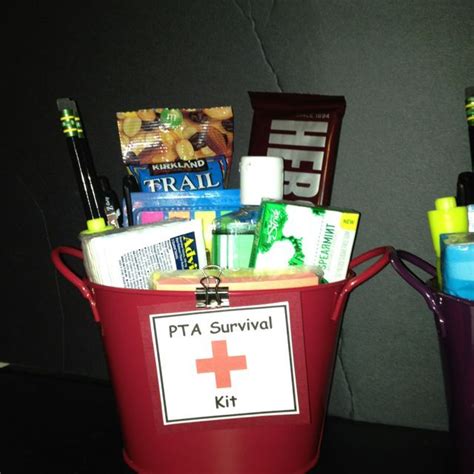 a red bucket filled with personal care items on top of a black table ...