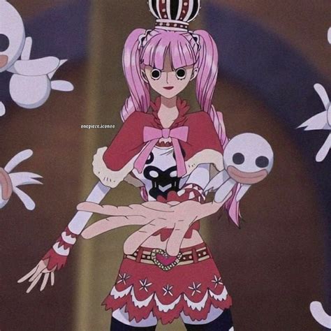 an anime character with pink hair is holding a doll and looking at the ...