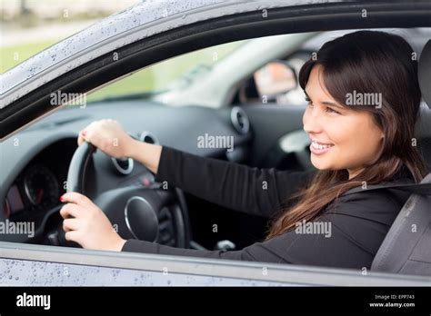 Business woman driving her new sports car Stock Photo - Alamy