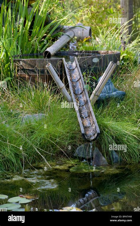 bamboo water feature Stock Photo - Alamy