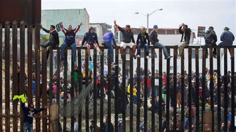 Caravan of migrants reaches US border, temporarily turned away by ...