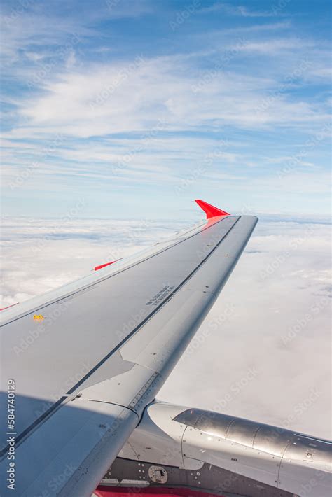 Wing view during flight Stock Photo | Adobe Stock