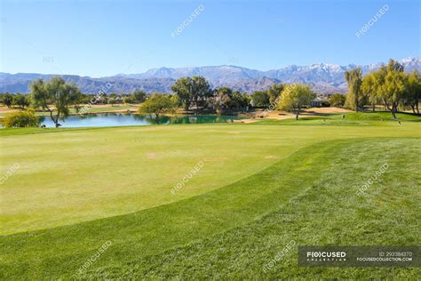 Amazing green lawn at golf course at sunny day — tranquil scene ...