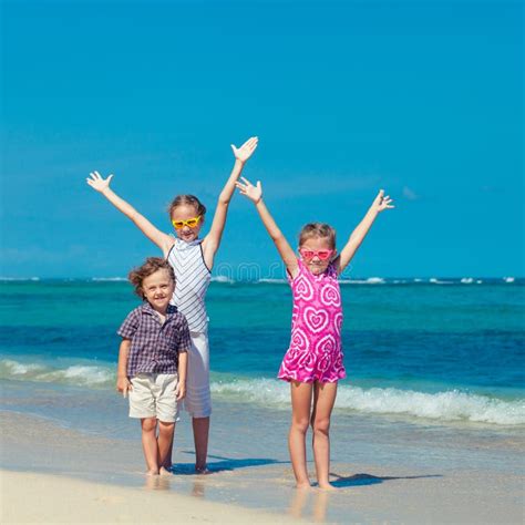 Happy Kids Playing on Beach Stock Image - Image of pulled, family: 43502475