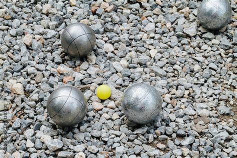 Petanque balls and the yellow wood jack Stock Photo | Adobe Stock