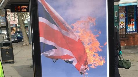 Bus stop vandalized with poster of burning British flag - CNN