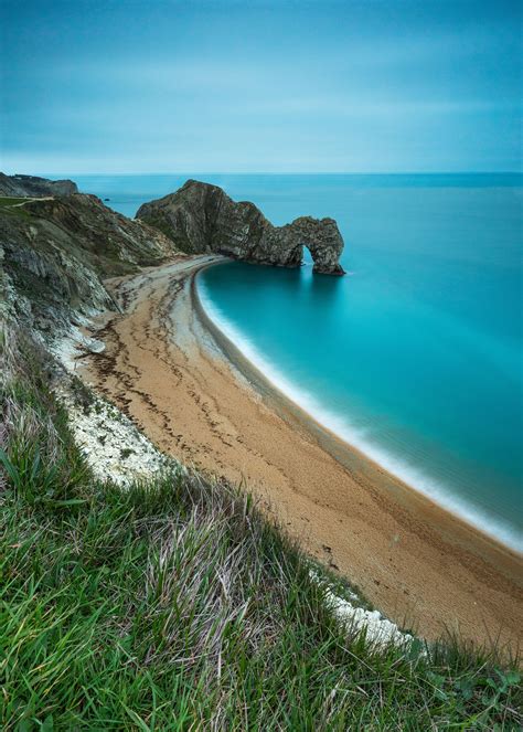 Durdle Door in Dorset England | Beach wallpaper, Uk beaches, Dorset coast