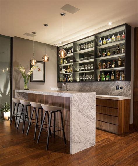 This modern house has a bar that features a shallow shelf with a ...