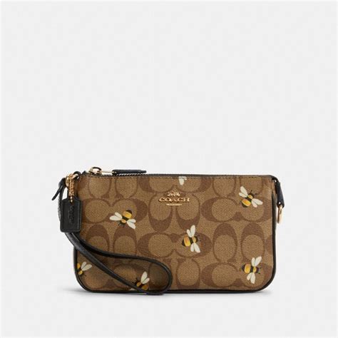 COACH OUTLET® | Nolita 19 In Signature Canvas With Bee Print in 2022 ...