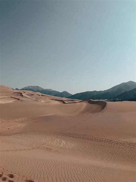 Sandboarding / Sledding at Great Sand Dunes National Park - Beyond The ...