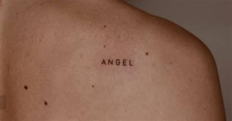 Lettering tattoo of the word "angel" done on the