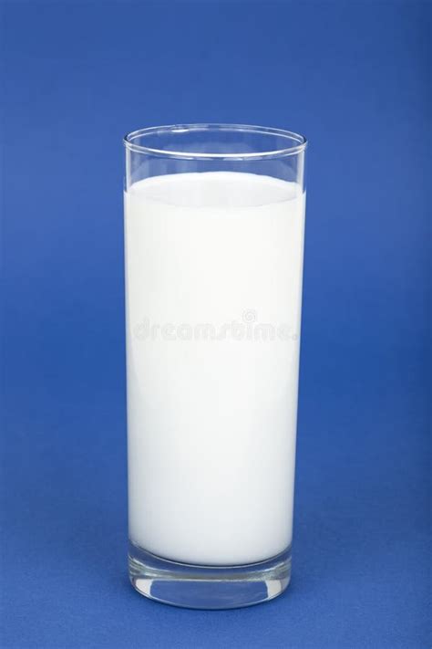 Glass Of Milk On A Blue Background Stock Photo - Image of blue ...