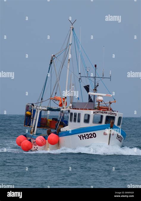 Fishing Trawler heading into harbour Stock Photo, Royalty Free Image ...