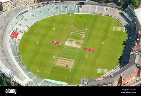 Aerial view shows groundsmen at work on the pitch at the Oval Cricket ...