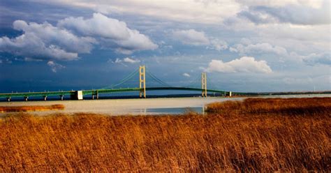 Workers preparing the Mackinac Bridge for winter