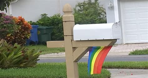 Couple Refusing To Take Down Tiny Pride Flag Under Mailbox After HOA Fine