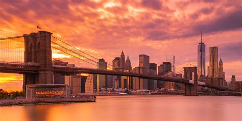 Sunset over Brooklyn Bridge in New York City Skyline Panorama ...