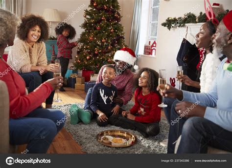 Multi Generation Family Celebrating Christmas Home Together Stock Photo ...