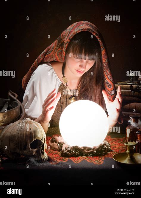 Gypsy with crystal ball predicting the future Stock Photo - Alamy