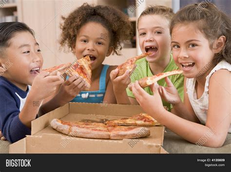 Four Young Children Indoors Eating Image & Photo | Bigstock