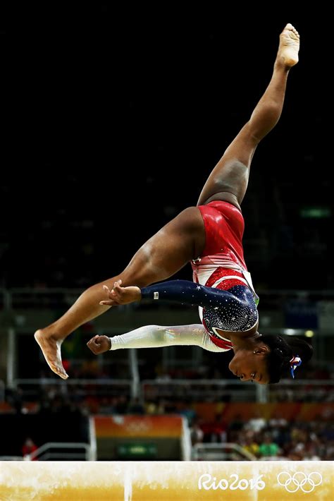 PHOTOS: Simone Biles & The USA Gymnastics Team Fly Into First Place