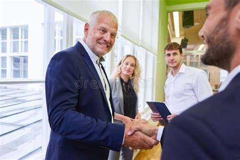 Business People Shaking Hands before a Meeting Stock Photo - Image of ...