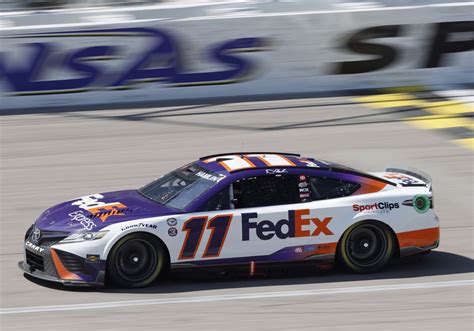 Denny Hamlin bumps Kyle Larson for lead on final lap to win at Kansas ...